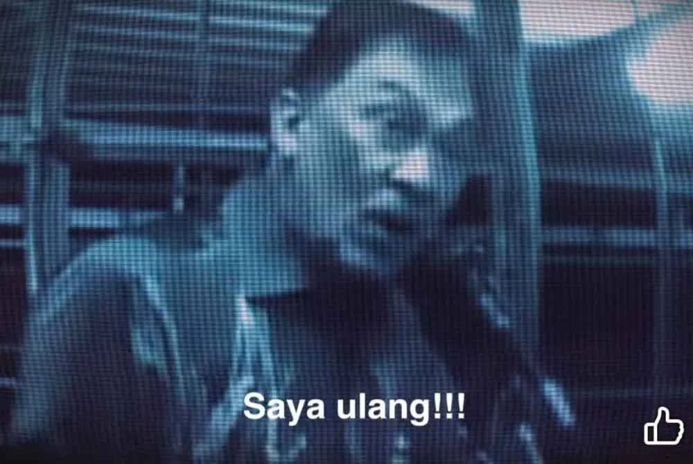 Seorang lelaki dengan kapsyen 'Saya ulang!!!'